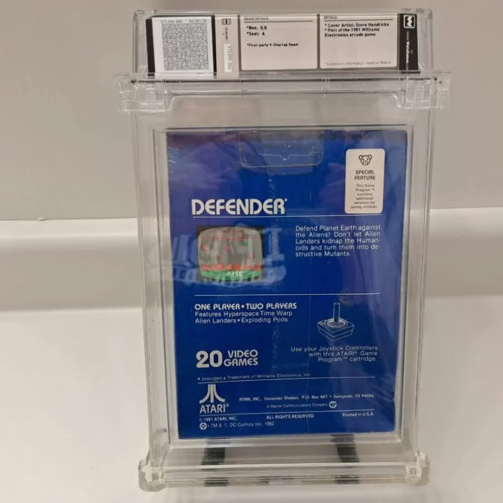 Atari 2600 DEFENDER - EARLY HANGTAB BLUE BOX! WATA GRADED 5.5! NEW & UNOPENED!